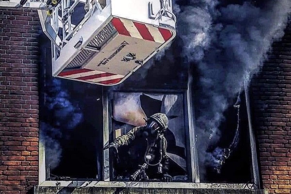 Brandweerman en ladder
